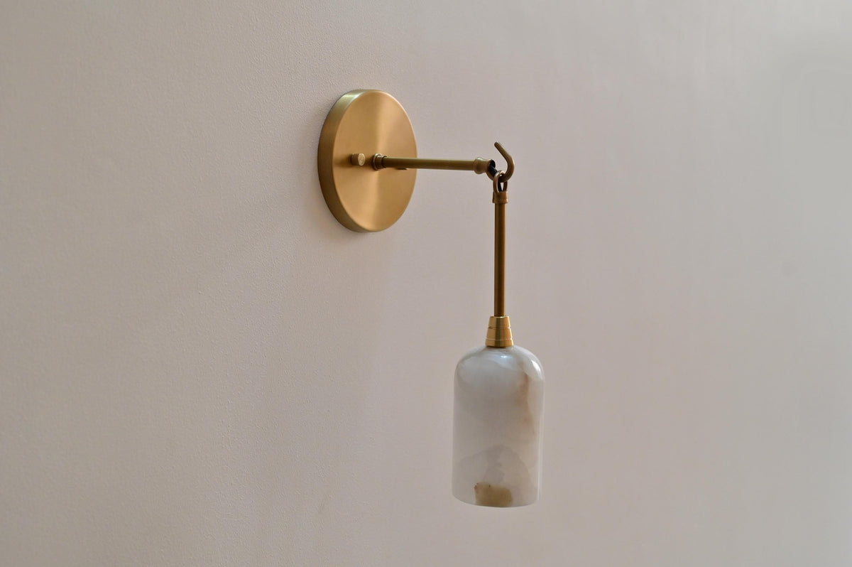 Alabaster and brass wall sconce with sculpted stone shade - Ember Lighting