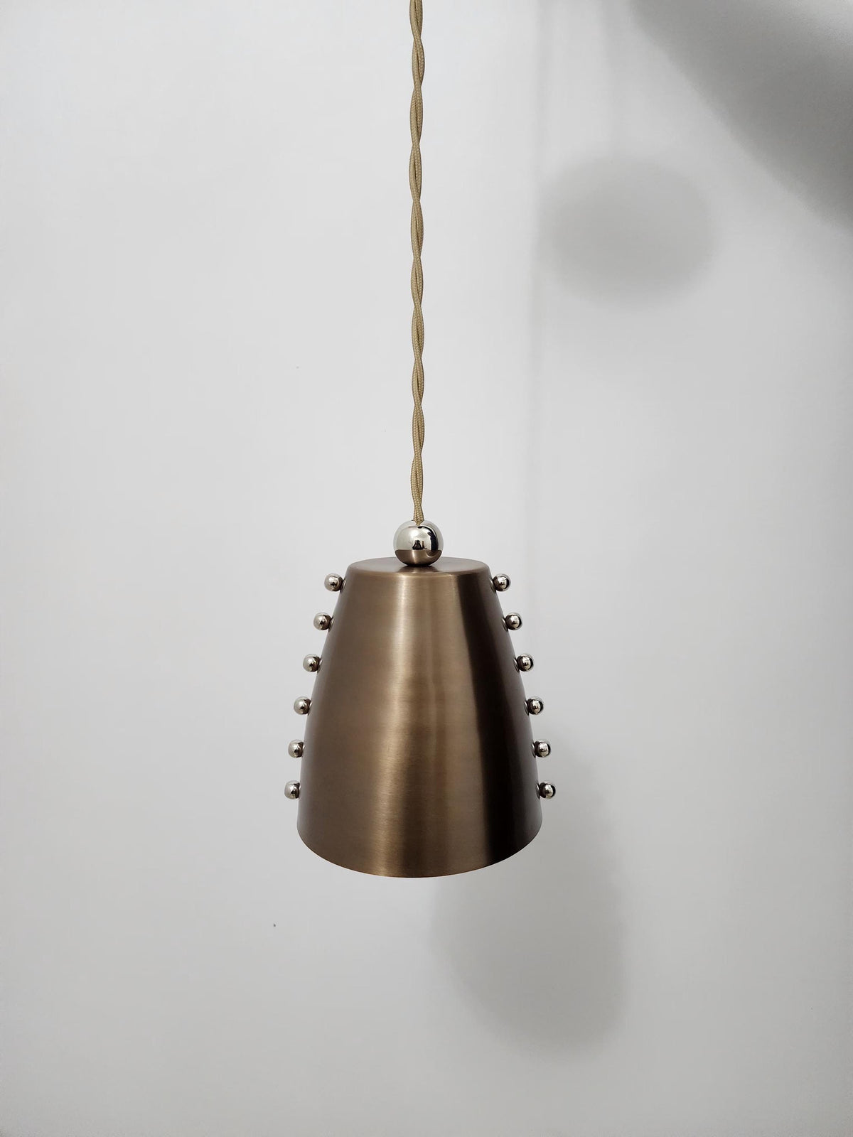 Antique Brass Wall Light With Tapered Cone Shade And Rivet Details - Ember Lighting