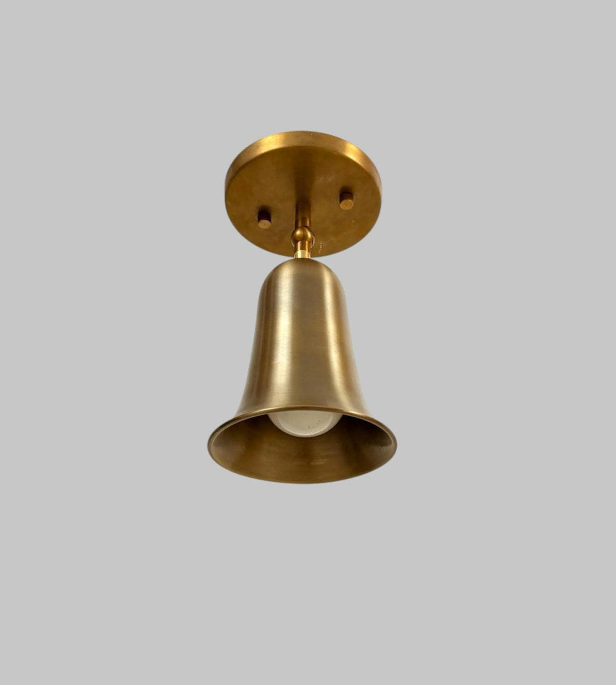 Brass bell cone bedside wall light Ember Lighting