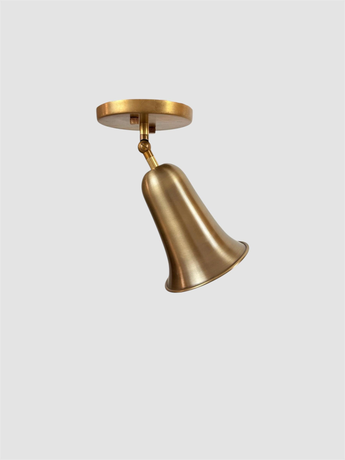 Brass bell cone bedside wall light Ember Lighting