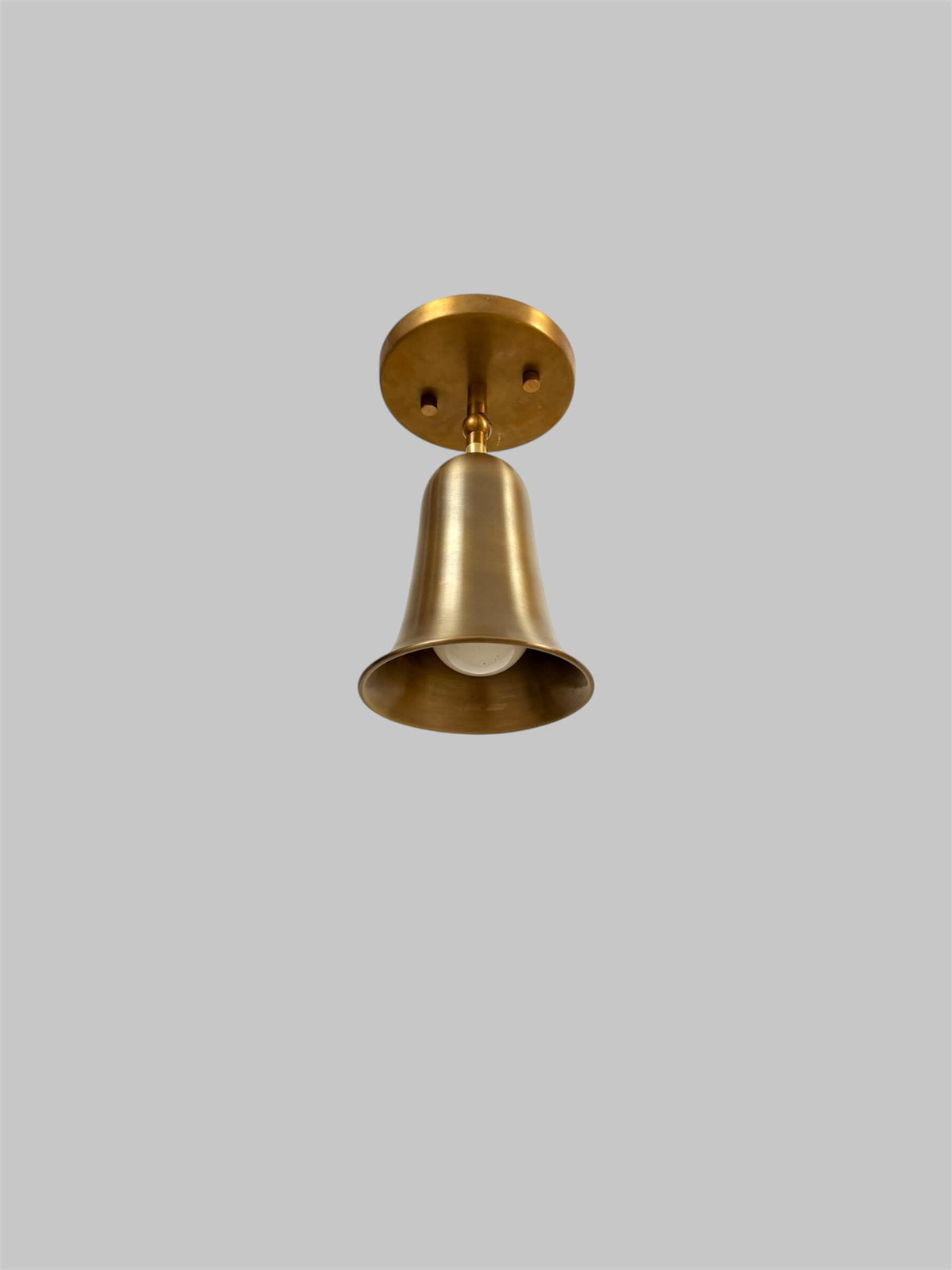 Brass bell cone bedside wall light Ember Lighting