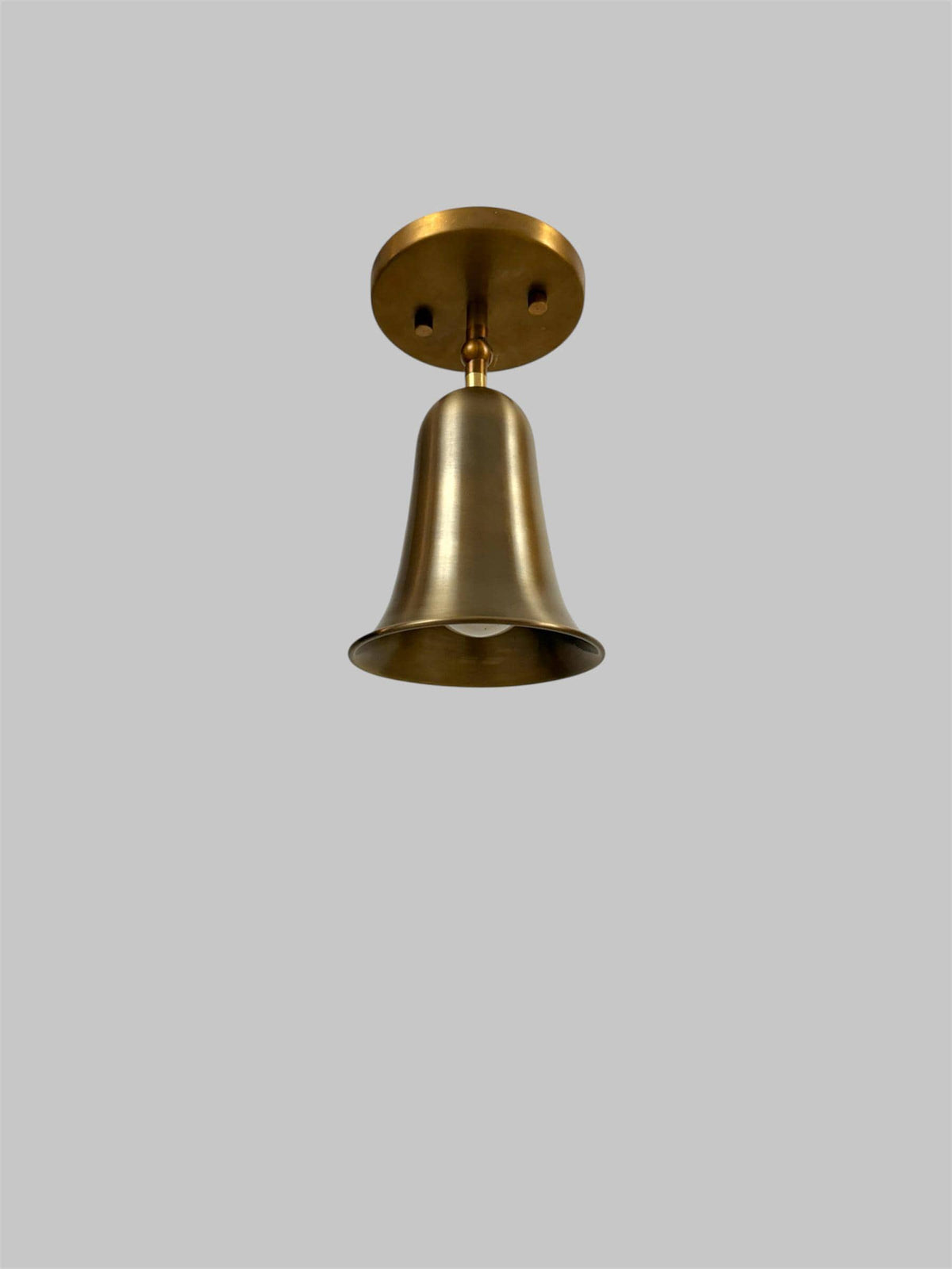 Brass bell cone bedside wall light Ember Lighting