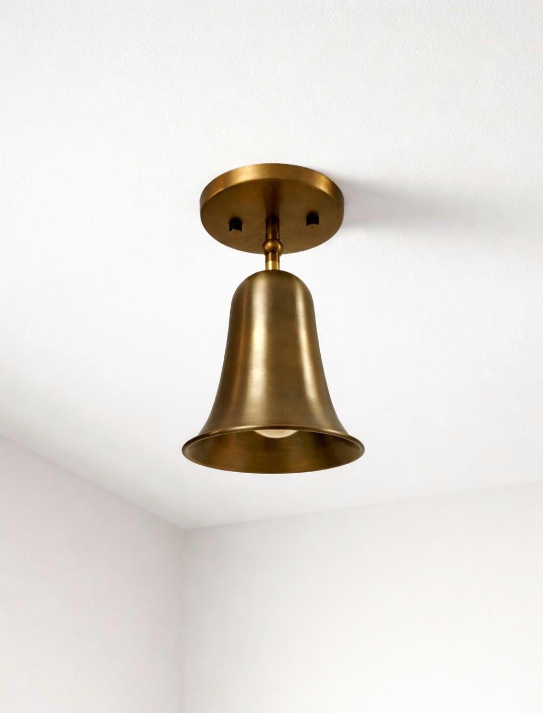 Brass bell cone bedside wall light Ember Lighting