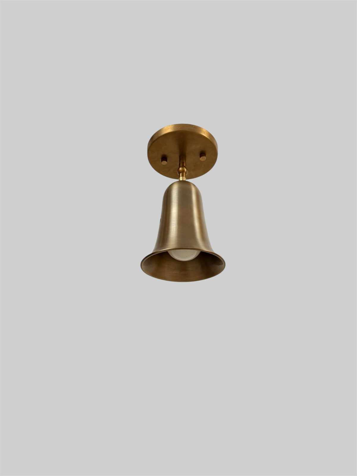 Brass bell cone bedside wall light Ember Lighting