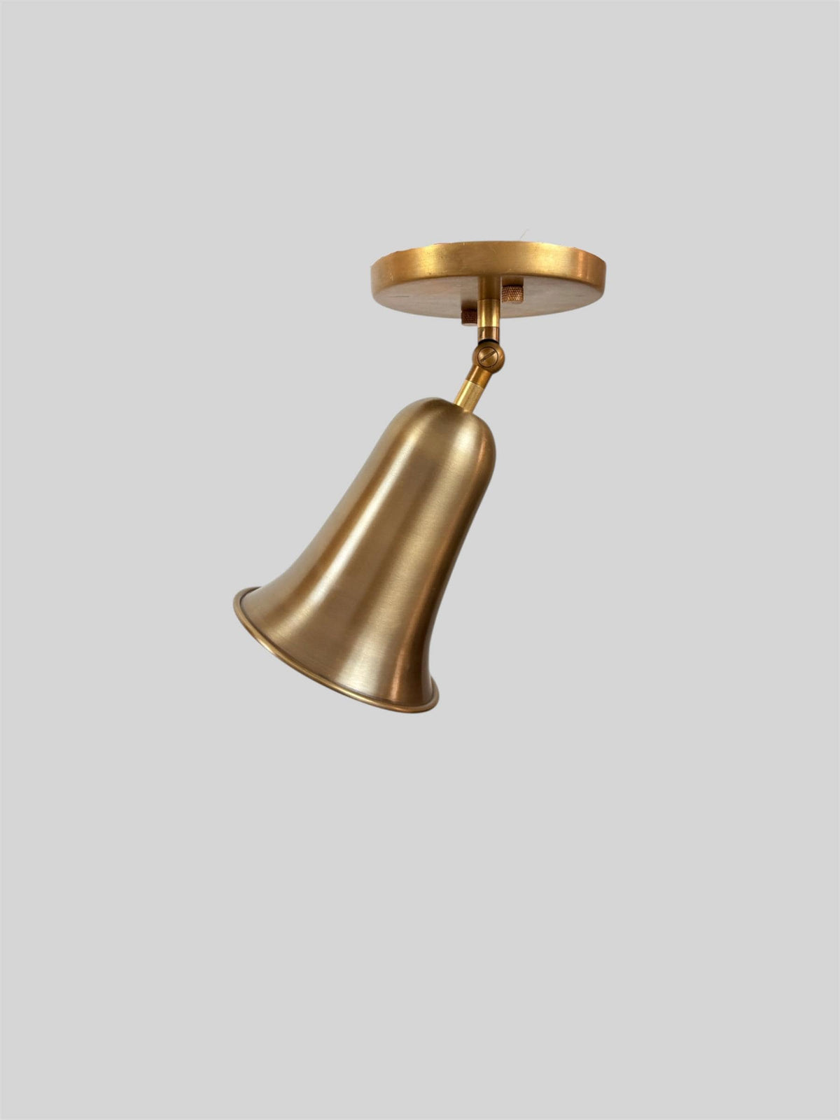 Brass bell cone bedside wall light Ember Lighting