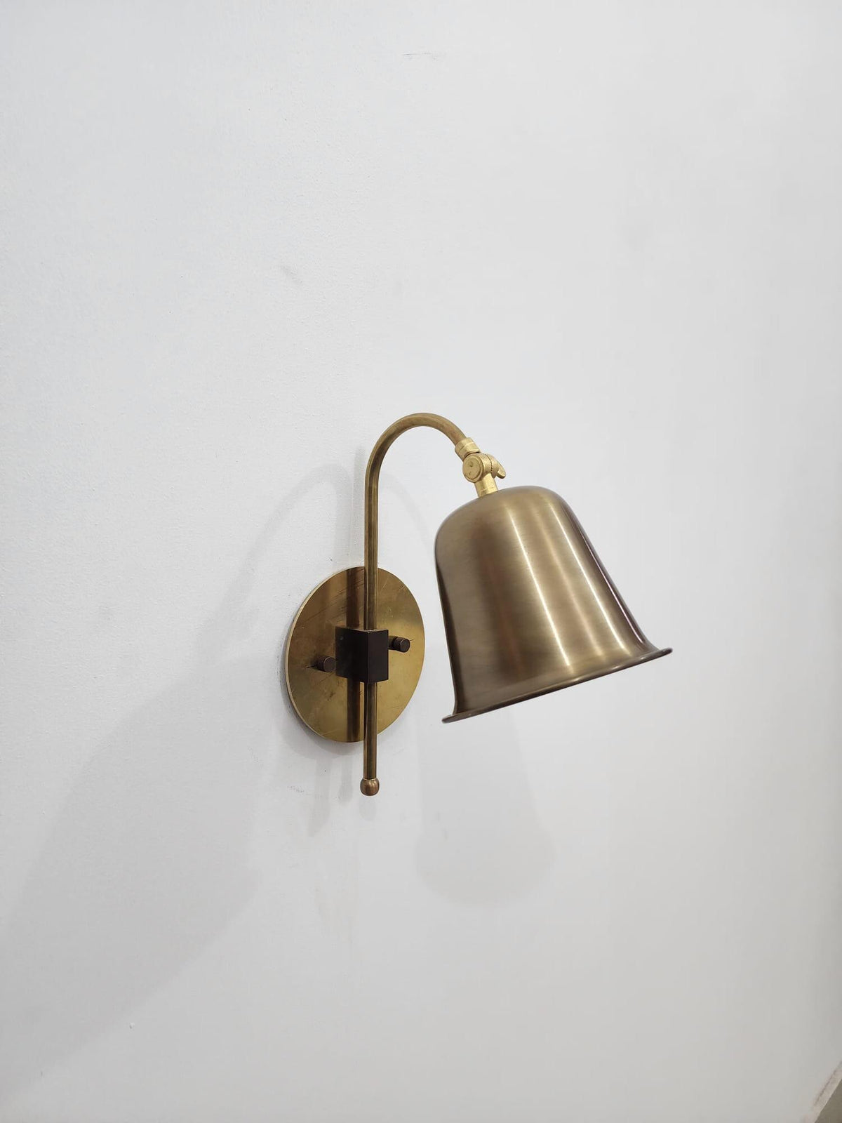 Classic brass wall sconce with adjustable top detail — Ember Lighting