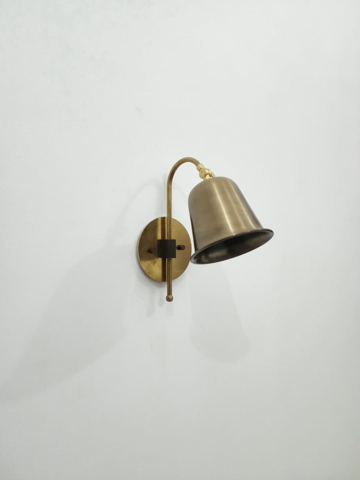 Classic brass wall sconce with adjustable top detail — Ember Lighting