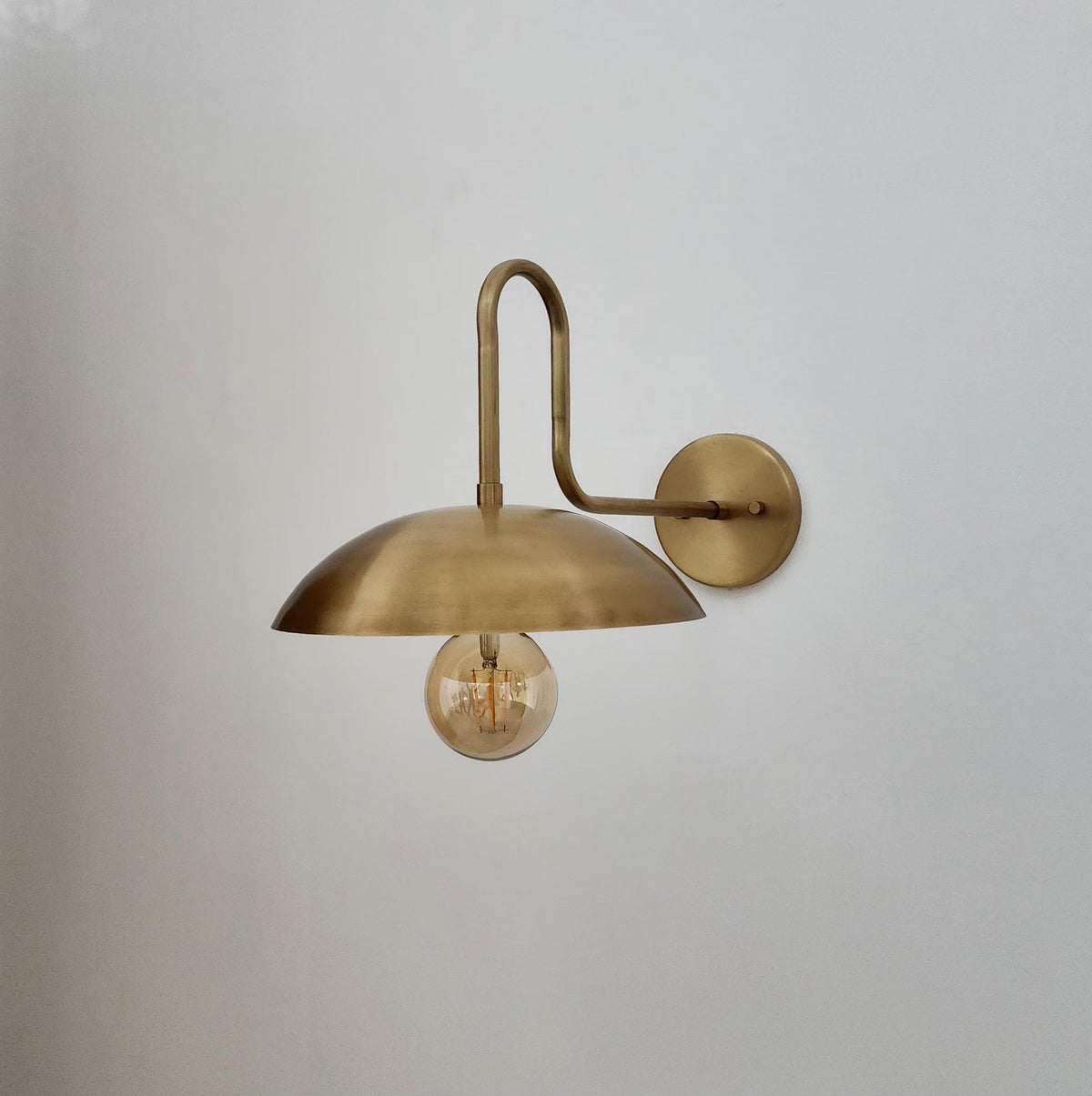 Curved Brass Gooseneck Wall Sconce with Opal Glass Globe | Ember Lighting