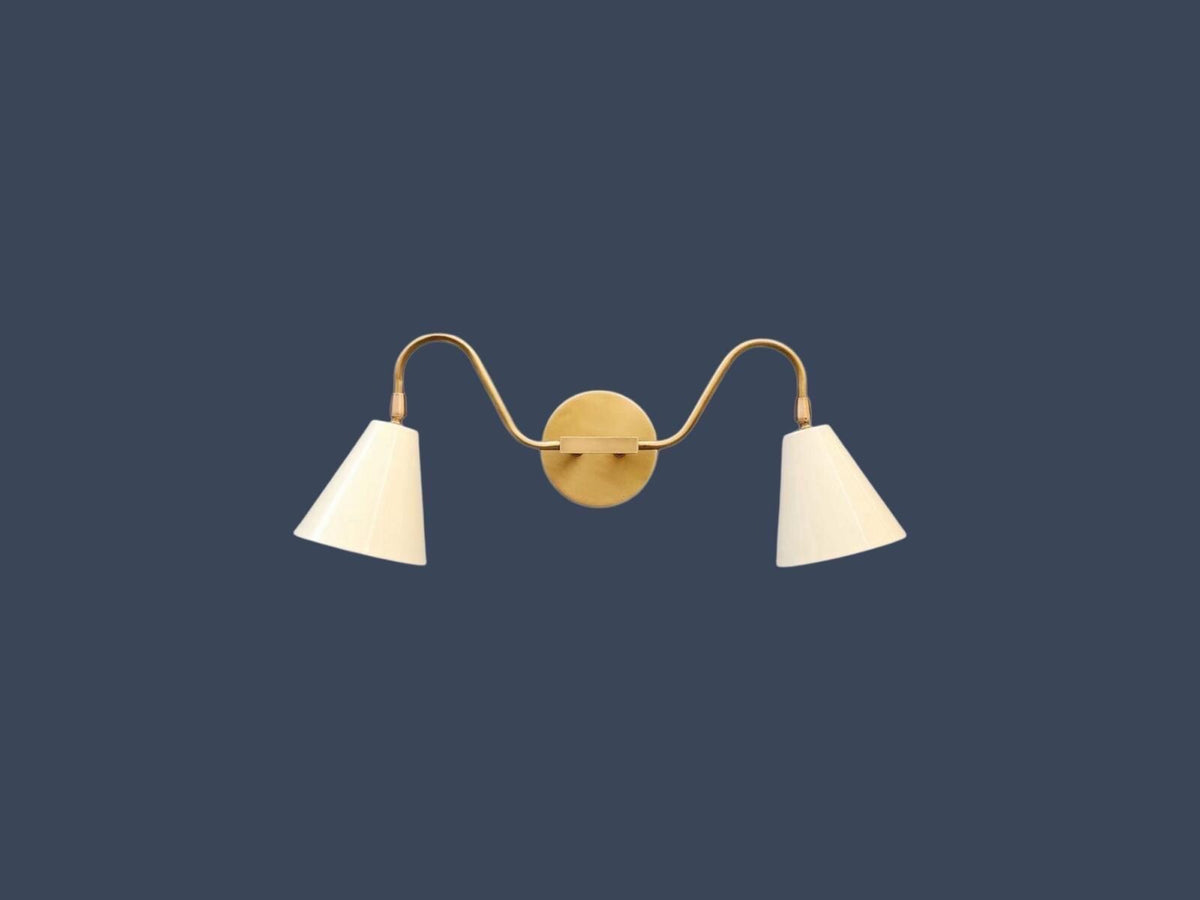 Elegant double arm wall sconce in modern brass style. Ember Lighting