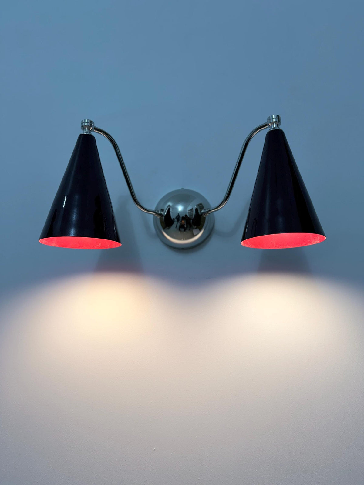 Elegant double cone brass sconce with stylish wine shades. Ember Lighting