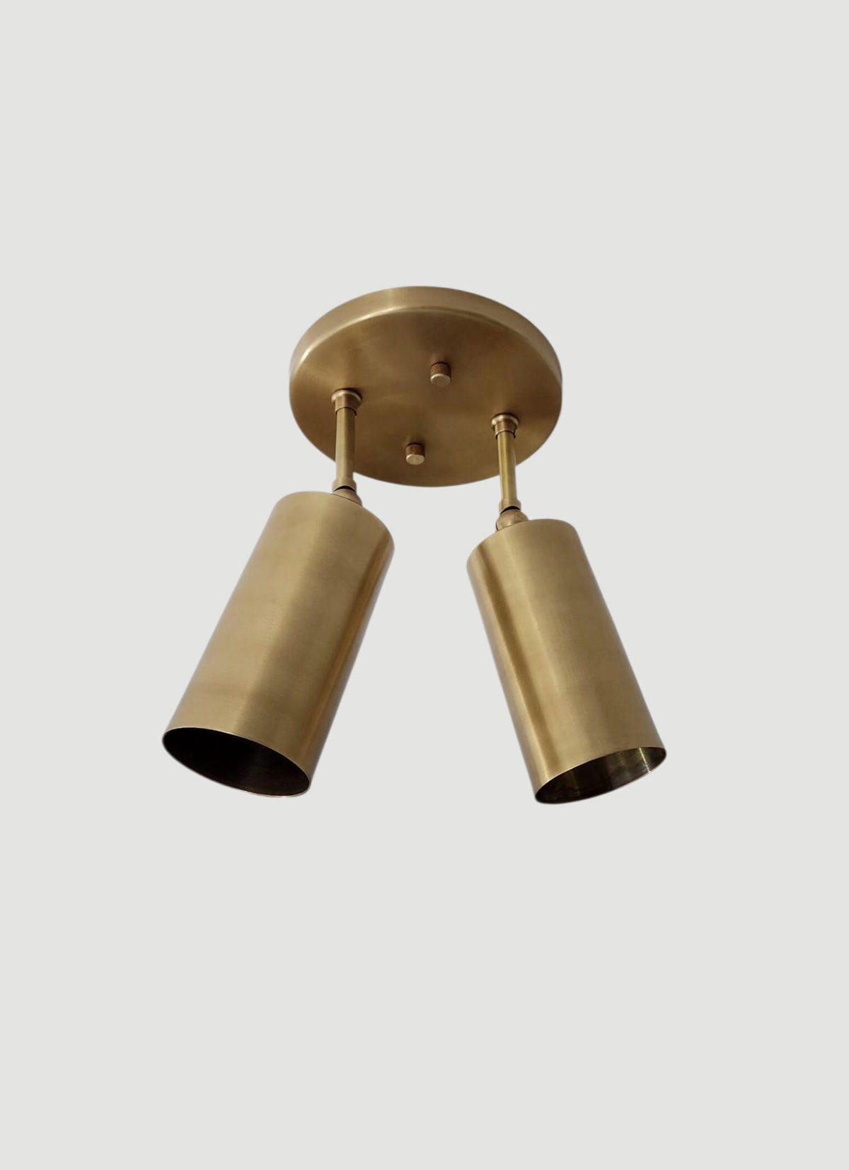 Flush mount ceiling light with modern brass dual shades. Ember Lighting