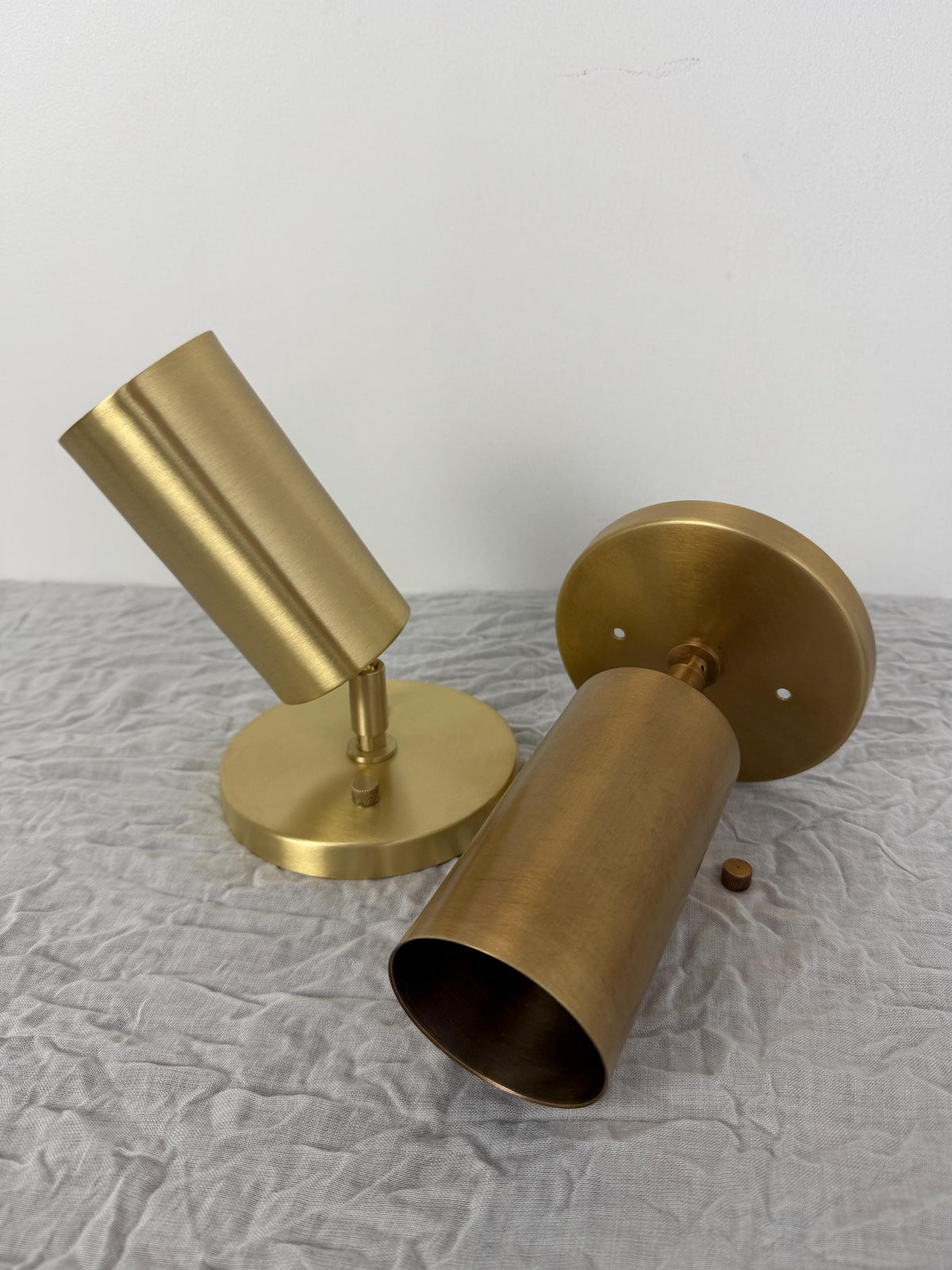 Handcrafted brass spotlight ceiling fixture in mid-century style. Ember Lighting