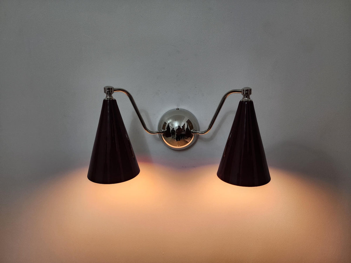 Mid-century double cone brass sconce with wine shades. Ember Lighting