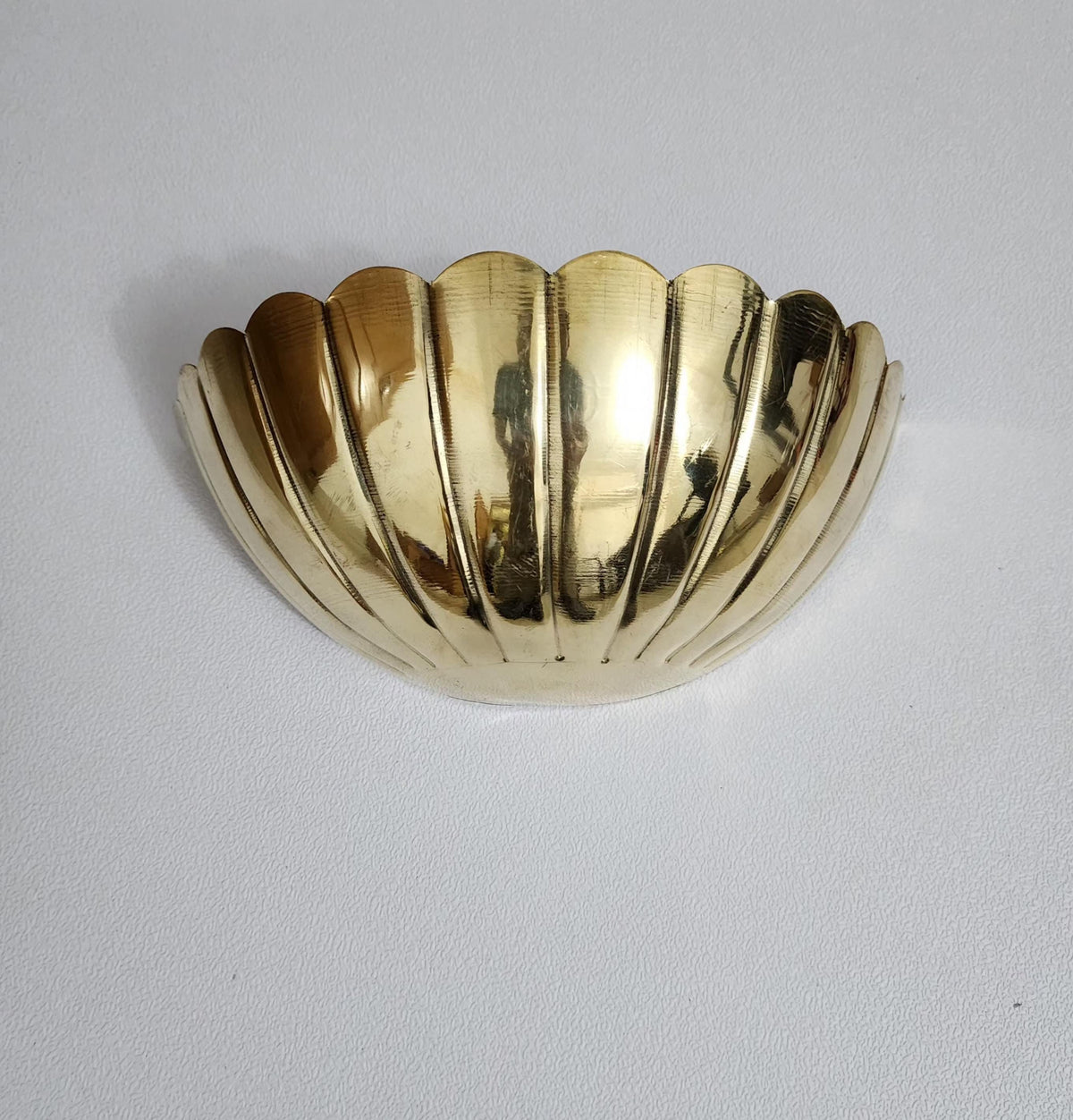 Modern Art Deco brass wall sconce with half-flower design — Ember Lighting