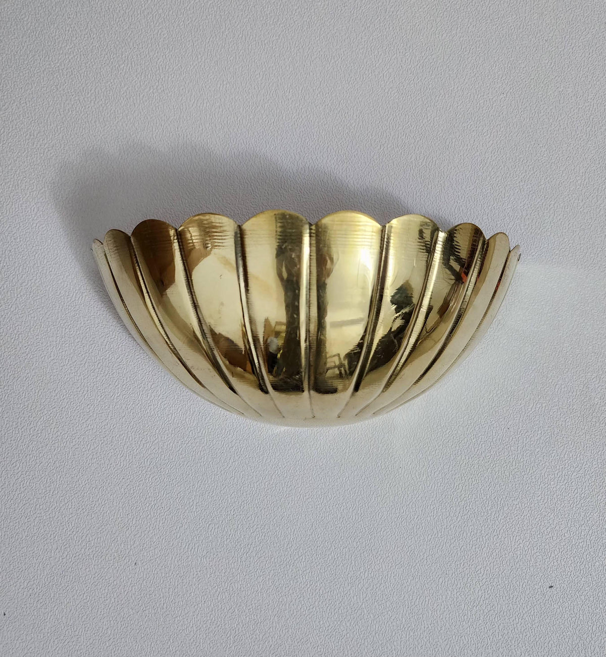 Modern Art Deco brass wall sconce with half-flower design — Ember Lighting