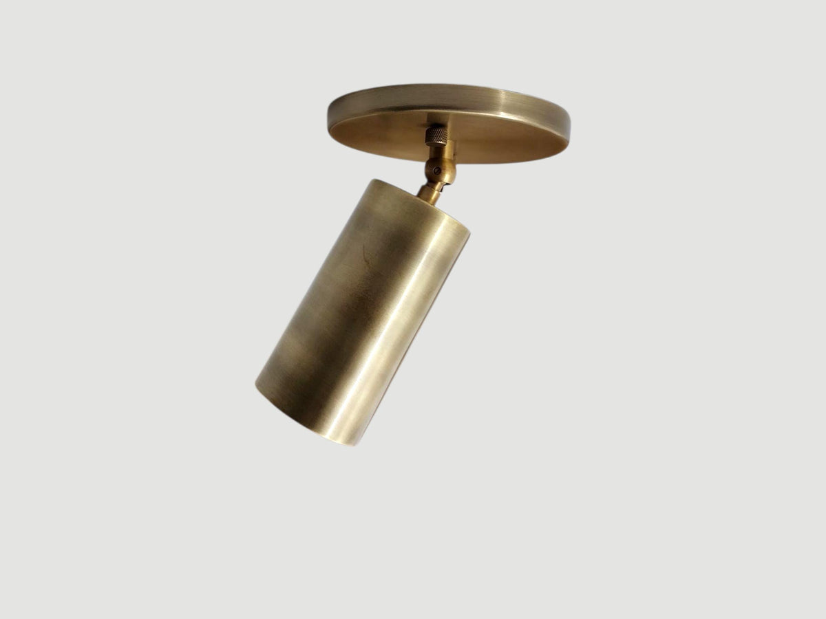 Modern brass ceiling spotlight with mid-century inspired design. Ember Lighting
