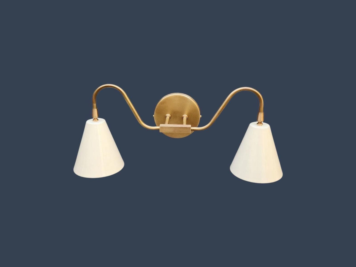 Modern brass lighting with double arm wall sconce design. Ember Lighting