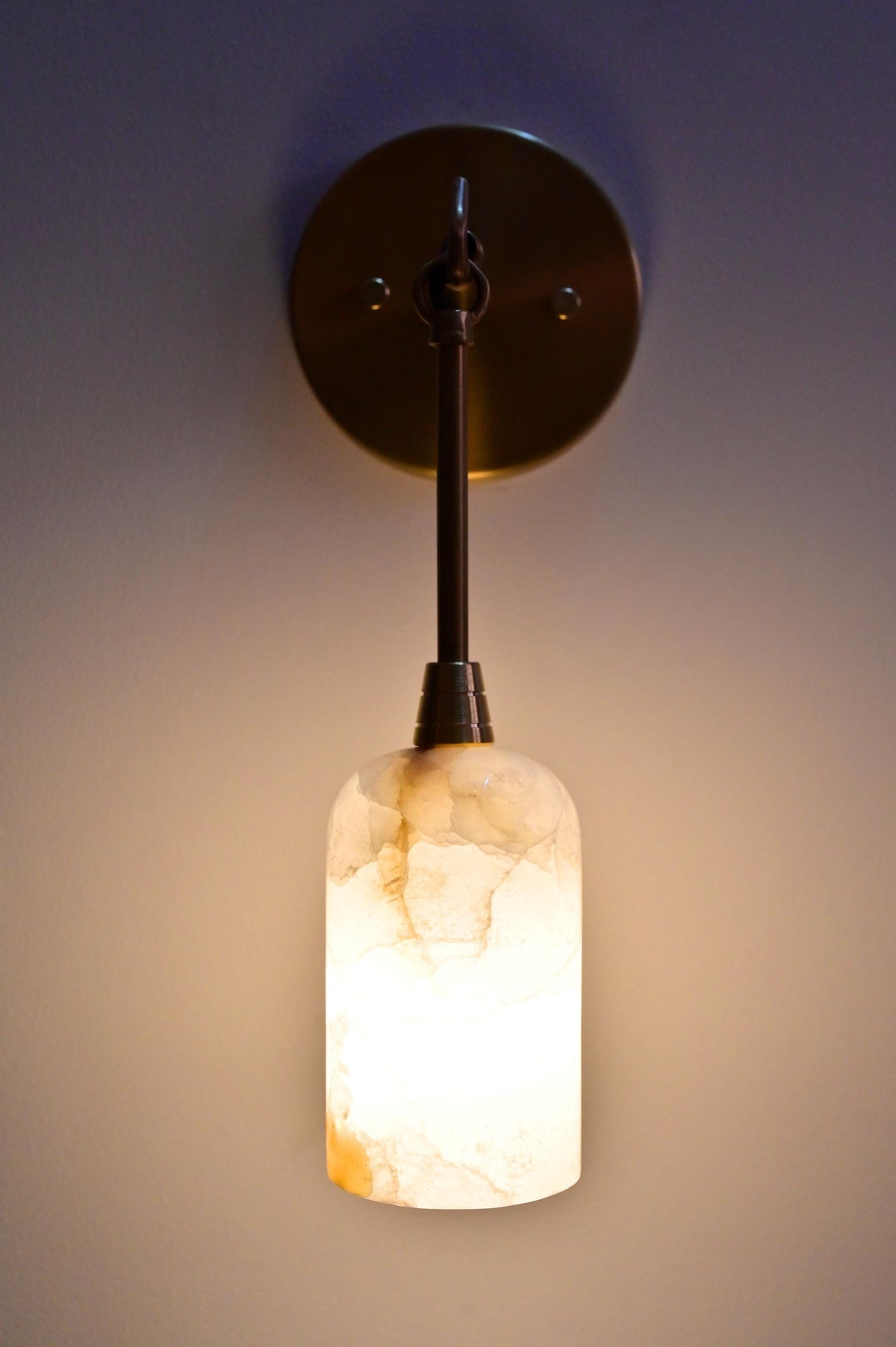 Natural stone and brass wall sconce for upscale interiors - Ember Lighting