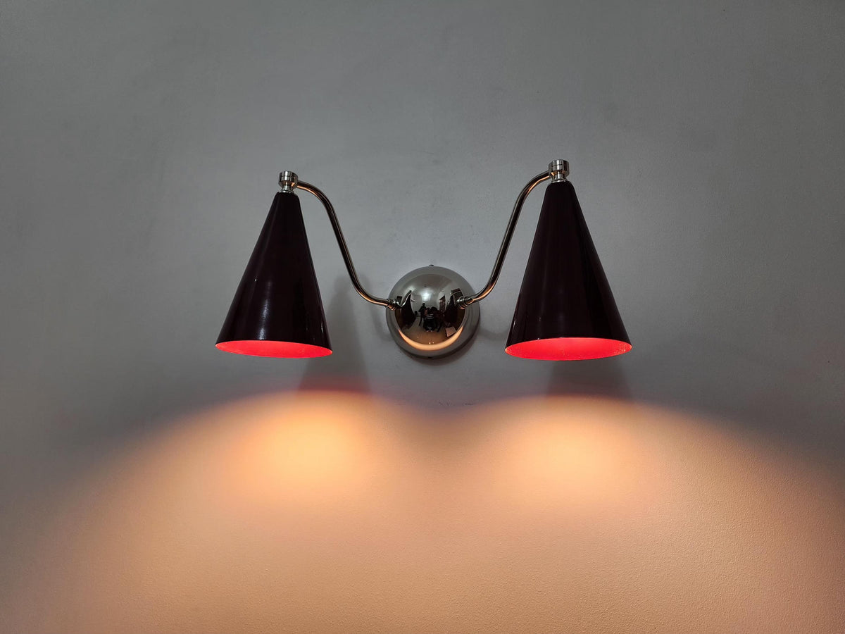 Stylish double cone brass sconce with elegant wine shade feature. Ember Lighting