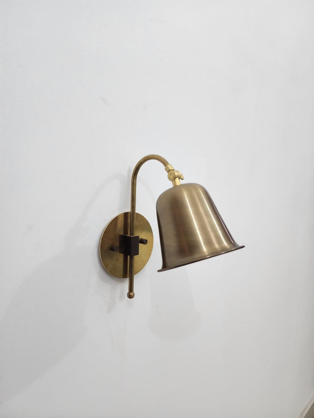Vintage brass reading wall light with cone shade — Ember Lighting