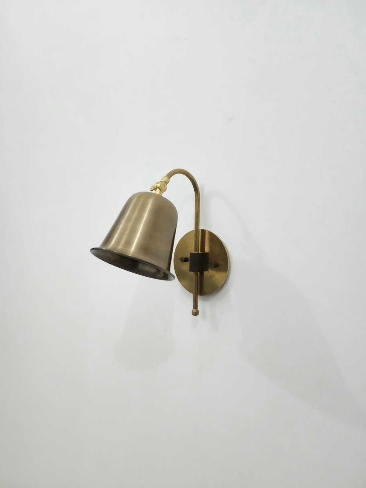 Vintage brass reading wall light with cone shade — Ember Lighting