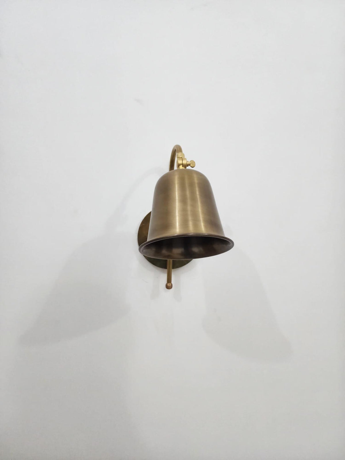 Vintage-inspired brass wall light with cone shade — Ember Lighting